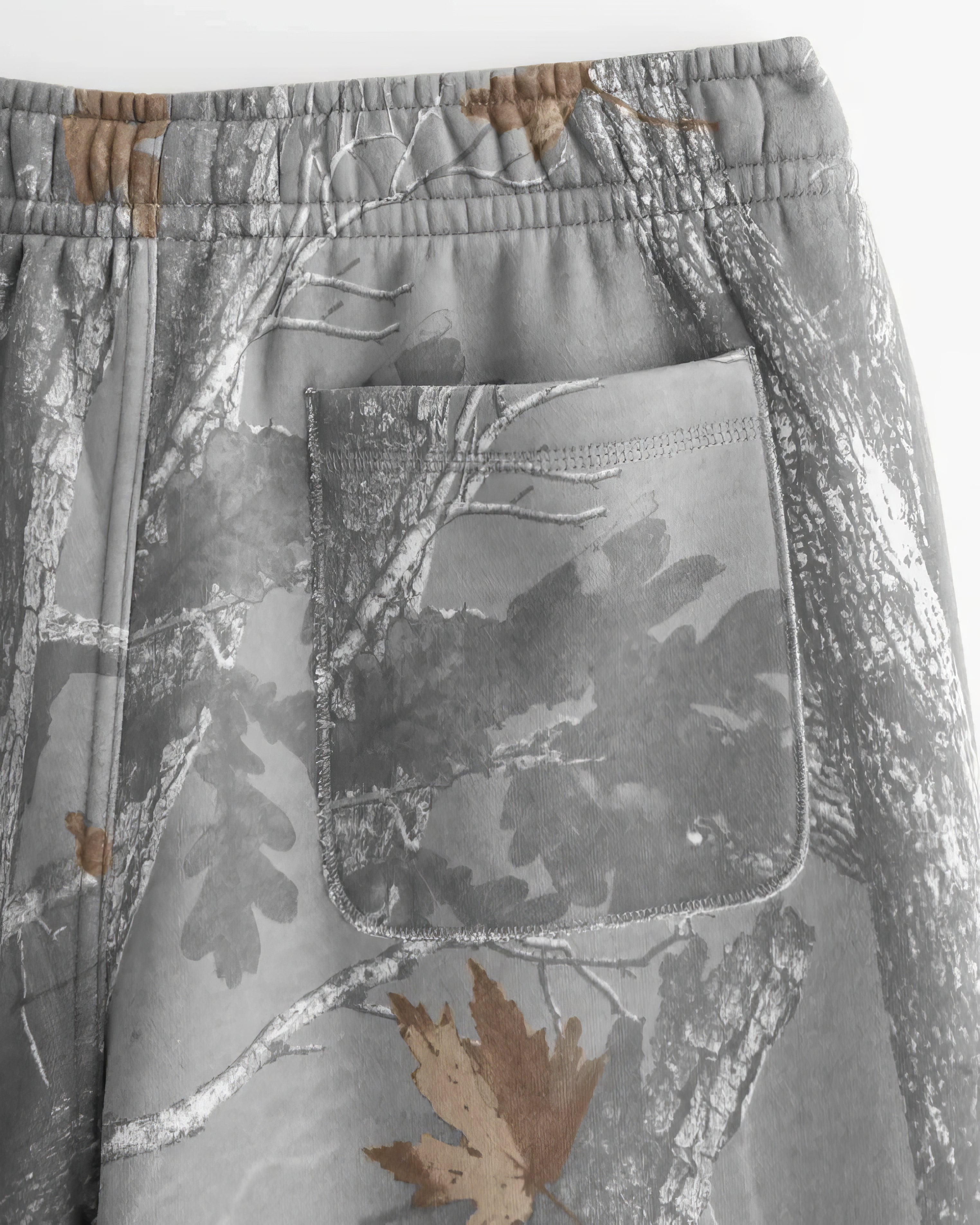 WIDE LEG CAMO SWEATPANTS